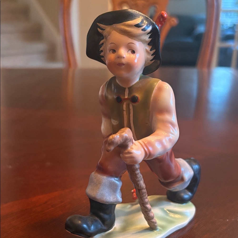 Charming Figurine with Black Hat and Brown Outfit